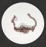 This Fascinating Wire Wrapped Copper Bracelet with Agate is a stunning piece that beautifully marries the elegance of Agate with the intricate artistry of wire wrapping. Its adjustable design ensures a comfortable fit for various wrist sizes, making it a versatile and attractive addition to any jewelry collection.