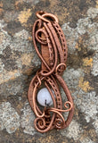 Handmade woven copper pendant with Tourmalinated Quartz quartz bead.