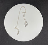 This delightful necklace features two miniature Sterling Silver cats under a crescent moon, evoking a sense of whimsy and wonder. Perfectly detailed, the pendant is both playful and elegant, making it an ideal gift for cat lovers and dreamers alike. Suspended on a 20" Sterling Silver chain, this necklace adds a touch of charm to any outfit.