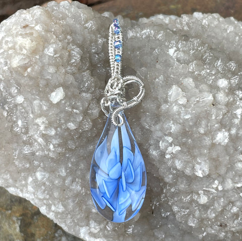 Beautiful Blue Lampwork Glass Pendant in Argentium Silver with glass beads on the bail. 