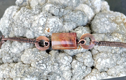 This handcrafted bracelet features the bold, artistic patterns of Picasso Jasper, Copper circles and wire wrapped copper to enhance the stone's striking natural lines and earthy tones.