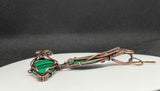 These handcrafted earrings feature rich green malachite stones wrapped in a combination of square and twisted square copper wire, adding depth and dimension to the design. The swirling bands of the malachite beautifully complement the warm copper tones, while hypoallergenic niobium ear wires ensure all-day comfort. A perfect blend of bold elegance and natural beauty—ideal for everyday wear or special occasions.