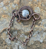 This striking Adjustable Sky Eye Jasper Bracelet features a unique design of wire-wrapped copper combined with the captivating beauty of Sky Eye Jasper. The adjustable feature ensures a comfortable fit for various wrist sizes, making it a versatile and stylish accessory.