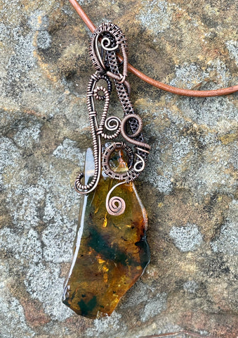Freeform Amber and Wire Wrapped Copper Necklace on adjustable leather cord.