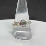 Colorful  Czech Glass Ring with flashes of green, purple, pink. blue and yellow in wire wrapped Argentium Silver.