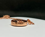 Bold and symbolic, this Copper and Obsidian Moon and Sun Necklace celebrates the balance of light and shadow. The design beautifully unites the radiant energy of the sun with the mysterious allure of the moon, creating a meaningful celestial statement piece.

Deep, glossy obsidian adds dramatic contrast to the warm glow of the copper. Its smooth, dark surface enhances the intricate metalwork while symbolizing protection and grounding energy.