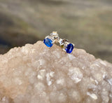 These elegant stud earrings feature deep blue Kyanite gemstones, set in sleek sterling silver (.925) for a timeless and versatile look. The natural shimmer and rich color of Kyanite make these studs a perfect choice for everyday wear or subtle sophistication. Lightweight and classic, they add a calming touch of color to any outfit.