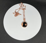 Bold and symbolic, this Copper and Obsidian Moon and Sun Necklace celebrates the balance of light and shadow. The design beautifully unites the radiant energy of the sun with the mysterious allure of the moon, creating a meaningful celestial statement piece.

Deep, glossy obsidian adds dramatic contrast to the warm glow of the copper. Its smooth, dark surface enhances the intricate metalwork while symbolizing protection and grounding energy.