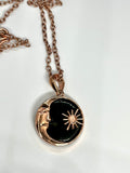 Bold and symbolic, this Copper and Obsidian Moon and Sun Necklace celebrates the balance of light and shadow. The design beautifully unites the radiant energy of the sun with the mysterious allure of the moon, creating a meaningful celestial statement piece.

Deep, glossy obsidian adds dramatic contrast to the warm glow of the copper. Its smooth, dark surface enhances the intricate metalwork while symbolizing protection and grounding energy.