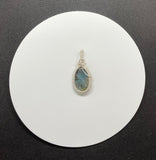 Beautiful Blue Carved Labradorite Pendant in wire wrapped Argentium Silver.