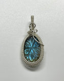 Beautiful Blue Carved Labradorite Pendant in wire wrapped Argentium Silver.