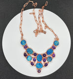 This dazzling necklace features shimmering titanium druzy paired with rich purple Amethyst, all set in warm copper. Brilliant flashes of blue and purple create an eye-catching piece full of sparkle and personality.