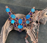 This dazzling necklace features shimmering titanium druzy paired with rich purple Amethyst, all set in warm copper. Brilliant flashes of blue and purple create an eye-catching piece full of sparkle and personality.