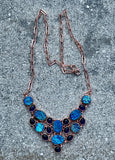 This dazzling necklace features shimmering titanium druzy paired with rich purple Amethyst, all set in warm copper. Brilliant flashes of blue and purple create an eye-catching piece full of sparkle and personality.