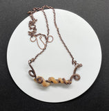 One of a kind Self Collected Worm Snail Shell Necklace in Wire Wrapped Copper.