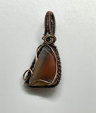 Tumbled Orange and Clear Agate Pendant in Wire Wrapped Copper.