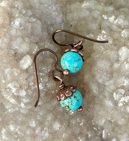 These lovely earrings feature vibrant turquoise beads topped with warm copper bead caps, creating a beautiful contrast of color and texture. Suspended from hypoallergenic niobium ear wires, they offer both comfort and style. Lightweight and versatile, they’re perfect for everyday wear or adding a pop of natural color to any look.