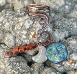 Hammered Copper Ear Cuff with 3 interchangeable celestial dangles.&nbsp; Comes with Goldstone stars dangle, an iridescent Glass full moon dangle&nbsp; and a Mother of Pearl half moon dangle. Wear one, none or all three, it's like 4 earrings in one! This was designed to be worn on the left ear. 