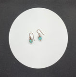 These lovely earrings feature vibrant turquoise beads topped with warm copper bead caps, creating a beautiful contrast of color and texture. Suspended from hypoallergenic niobium ear wires, they offer both comfort and style. Lightweight and versatile, they’re perfect for everyday wear or adding a pop of natural color to any look.