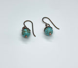 These lovely earrings feature vibrant turquoise beads topped with warm copper bead caps, creating a beautiful contrast of color and texture. Suspended from hypoallergenic niobium ear wires, they offer both comfort and style. Lightweight and versatile, they’re perfect for everyday wear or adding a pop of natural color to any look.