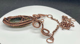 This enchanting necklace features a luminous Labradorite cabochon, cradled in an intricately handwoven copper frame with a Tree of Life design on the front. The flowing branches and detailed wirework highlight the stone’s mystical flashes of blue, green and yellow, symbolizing growth, grounding, and transformation. A meaningful and beautifully crafted piece, perfect for those who find magic in nature and strength in symbolism.