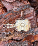 Fossilized Coral Guitar Pendant in Copper.