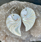 These Sterling Silver Carved Nautilus Shell "Angel Wing" Earrings are a captivating pair of earrings that combine the natural beauty of nautilus shells with the elegance of sterling silver. The earrings feature intricately carved nautilus shells, reminiscent of angel wings, set in high-quality sterling silver. These earrings evoke a sense of grace, nature, and artistry, making them a unique and elegant accessory.