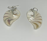 These Sterling Silver Carved Nautilus Shell "Angel Wing" Earrings are a captivating pair of earrings that combine the natural beauty of nautilus shells with the elegance of sterling silver. The earrings feature intricately carved nautilus shells, reminiscent of angel wings, set in high-quality sterling silver. These earrings evoke a sense of grace, nature, and artistry, making them a unique and elegant accessory.