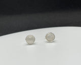 These Sterling Silver Rainbow Moonstone Stud Earrings are ideal for individuals who appreciate elegant, understated jewelry with natural gemstones. They appeal to those who value timeless designs with a touch of magic from the iridescence of moonstone. These earrings are perfect for anyone seeking a versatile and sophisticated piece that can be worn daily or for special occasions.