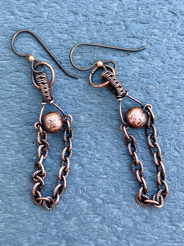 These Hypoallergenic Copper Ball and Chain Earrings feature a sleek and modern design that combines the elegance of copper with hypoallergenic materials. These earrings are crafted with copper balls and delicate chains, offering a stylish and minimalist look. Designed for comfort and sensitivity, they are an excellent choice for individuals with metal allergies or sensitivities.