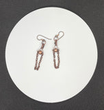 These Hypoallergenic Copper Ball and Chain Earrings feature a sleek and modern design that combines the elegance of copper with hypoallergenic materials. These earrings are crafted with copper balls and delicate chains, offering a stylish and minimalist look. Designed for comfort and sensitivity, they are an excellent choice for individuals with metal allergies or sensitivities.