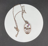 Whimsical Copper Mushroom Necklace with Faceted Amethyst Accent.