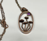 This Whimsical Copper Mushroom Necklace with Faceted Amethyst Accent is a delightful accessory that combines playful design with elegant gemstone accents. Perfect for adding a touch of whimsy to your outfit, this necklace makes a unique gift for someone special or a charming addition to your own jewelry collection.