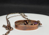 This Whimsical Copper Mushroom Necklace with Faceted Amethyst Accent is a delightful accessory that combines playful design with elegant gemstone accents. Perfect for adding a touch of whimsy to your outfit, this necklace makes a unique gift for someone special or a charming addition to your own jewelry collection.