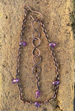 This charming adjustable ankle bracelet combines the warm glow of copper with the vibrant hues of purple Czech glass beads. The design features a delicate balance of color and texture, with the copper providing a sturdy yet flexible base and the Czech glass beads adding a touch of sparkle. The adjustable feature ensures a perfect fit for any ankle, making it a versatile and stylish accessory.