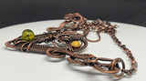 This Wire Wrapped Copper Necklace is a stunning display of artisan craftsmanship, combining various natural elements with intricate copper wire weaving. Featuring a woven copper heart, a symbolic copper Tree of Life, a warm Mookaite Jasper Sun, and a striking Dragon’s Vein Agate, this necklace is a work of art that carries deep symbolism and timeless beauty. It is the perfect statement piece for those who appreciate the elegance of handcrafted jewelry and the power of natural stones.