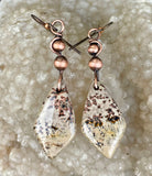 These Hypoallergenic Chohua Jasper and Copper Earrings feature beautifully patterned Chohua Jasper stones, in warm copper wire, with delicate copper bead accents. Designed for comfort and style, these earrings are not only visually striking but also hypoallergenic, making them ideal for customers with metal sensitivities. The earthy tones of the Chohua Jasper complement the richness of the copper, creating a perfect balance of natural beauty and artisanal craftsmanship.