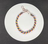 This Adjustable Colorful Satin Nylon Kumihimo Bracelet features a vibrant and stylish design created using the traditional Japanese kumihimo braiding technique. Made with colorful satin nylon cords, this bracelet is not only visually striking but also offers versatility with its adjustable fit.