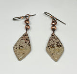 These Hypoallergenic Chohua Jasper and Copper Earrings feature beautifully patterned Chohua Jasper stones, in warm copper wire, with delicate copper bead accents. Designed for comfort and style, these earrings are not only visually striking but also hypoallergenic, making them ideal for customers with metal sensitivities. The earthy tones of the Chohua Jasper complement the richness of the copper, creating a perfect balance of natural beauty and artisanal craftsmanship.