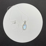 Shimmering iridescent Rainbow Moonstone Pendant is Sterling Silver on a 20" Sterling Silver chain. 