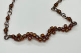 Delicate Adjustable Copper Bracelet with Glass Bead Wave Design. 