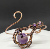 Adjustable Bracelet with hammered Copper, a Dog Tooth Amethyst Focal and wire wrapped Copper with Amethyst Bead Accents.