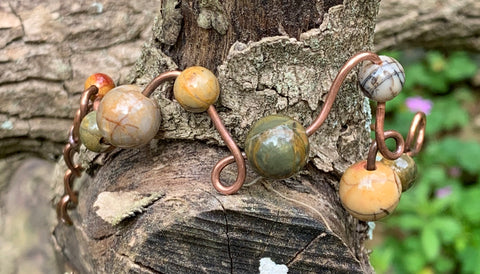 Heavy Gauge Copper that has been shaped and curved in this organic freeform bracelet with Picasso Jasper Beads.