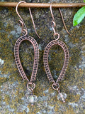 Handwoven Copper inverted teardrop earrings with clear crystal dangles on the end with hand made ear wires.
