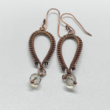 Handwoven Copper inverted teardrop earrings with clear crystal dangles on the end with hand made ear wires.