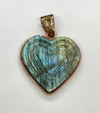 Shimmering Carved Labradorite Heart Pendant set in Copper with a Faceted Peridot set in the Bail. 