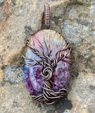 This Rainbow Quartz Tree of Life Pendant is a vibrant and enchanting piece featuring dyed Rainbow Quartz wrapped in intricate copper wire. This pendant combines the rich, multicolored beauty of Rainbow Quartz with the organic symbolism of the Tree of Life, creating a stunning and meaningful accessory.