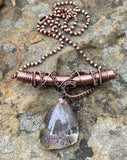 Intriguing Garden Quartz Necklace dangles from a Wire Wrapped Copper Tube Bail. Comes with a 19" Copper Ball Chain. 