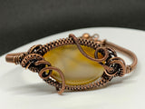 Creamy yellow to brown Agate Bracelet wrapped in handwoven copper with adjustable length fastener.