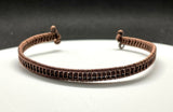 This Copper Wire Wrapped Cuff Bracelet features a Braided Copper Center for a unique look. 